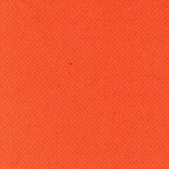 Fototapeta premium Vibrant coral orange woven paper texture with a repeating diagonal geometric pattern and visible fibers, ideal for backgrounds, packaging, crafts, textiles and graphic design.
