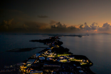 Lit Corridor — Night Aerial of Bermuda's Coast © BEEWHYLD
