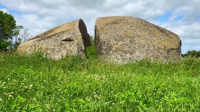 The Split Stone, a split stone block that is 14 m. long, 9 m. wide and 3 m. high, lying in a field at Glemmingebro, Ystad Municipality, Sk&aring;ne County, Sweden, Scandinavia