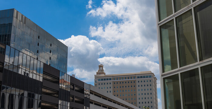 Urban Office Buildings Under Dramatic Blue Sky and Clouds