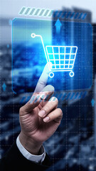 Businessman touching a virtual shopping cart icon on a futuristic digital display, symbol e-commerce, online shopping, and digital marketing. Concept of Online shopping, E-commerce and Modern Retail © Leo Lintang