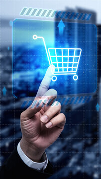 Businessman touching a virtual shopping cart icon on a futuristic digital display, symbol e-commerce, online shopping, and digital marketing. Concept of Online shopping, E-commerce and Modern Retail