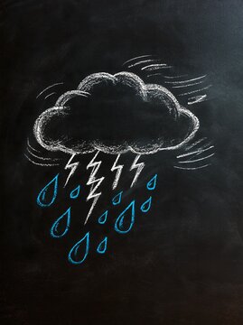 Storm cloud chalk drawing on blackboard with lightning bolts and blue raindrops, wind swirl lines, weather education art for school lesson, forecast notice
