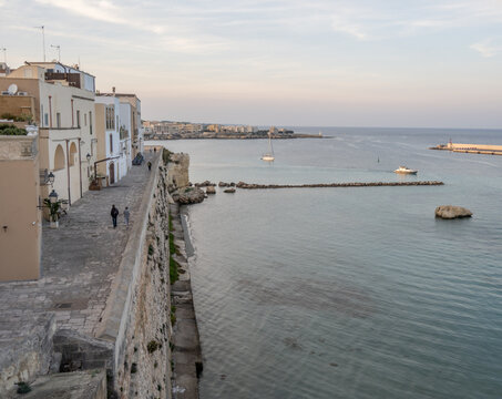 Seaside promenade and white buildings along the coast at Otranto, Puglia, Italy