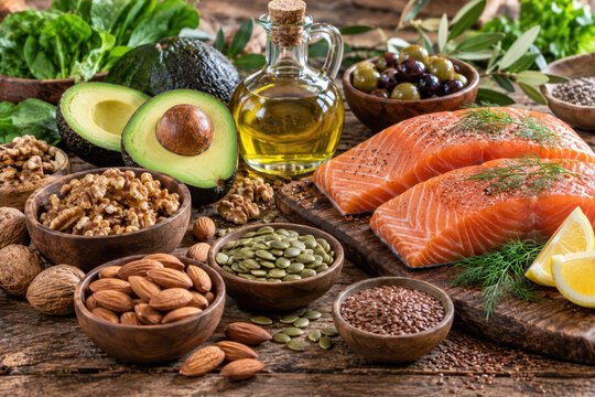 Healthy Fats Food Sources with Salmon, Avocado, Nuts and Olive Oil