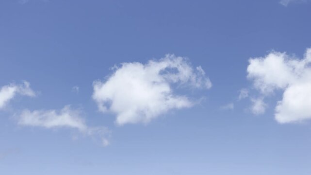Cumulus generally refers to the puffy, white, cotton-like clouds with flat bases and rounded tops often seen on sunny days. in Waikiki, Honolulu, Oahu, Hawaii.