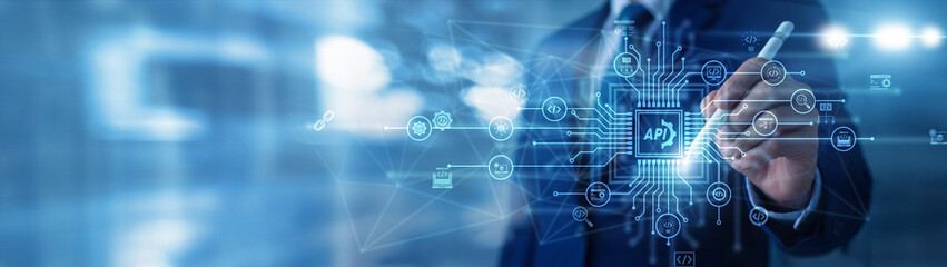 API concept with software developer using digital tools to connect apps and exchange data. Modern...