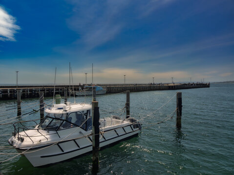 Patrol Boat And Fishing Boat Before Pier