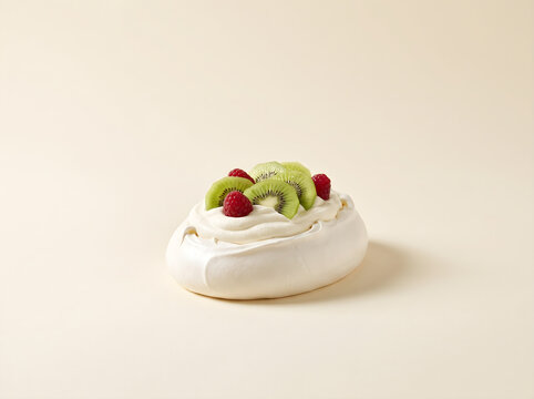 Delicious homemade pavlova kiwi dessert topped with fresh cream, ripe berries, and sliced kiwi fruit