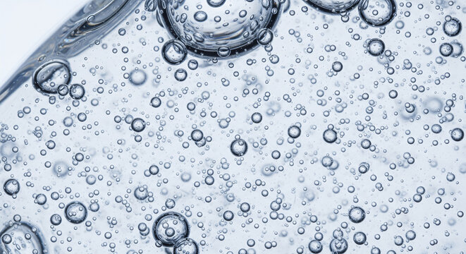 Extreme close-up of tiny oxygen bubbles inside a clear liquid gel