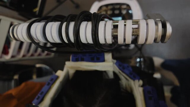 Digital perm equipment connected to hair rods in a salon