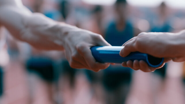 Athletic Relay Race Baton Handover Action Closeup Between Two Runners Passing
