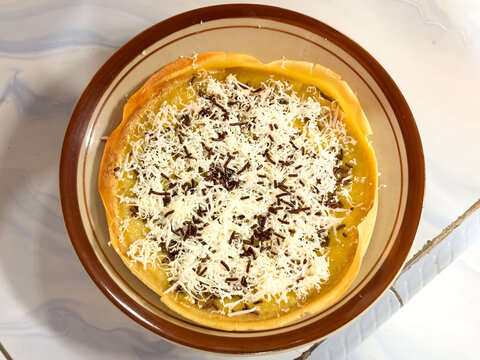 Indonesian Crispy Sweet Pancake with Grated Cheese and Chocolate Sprinkles