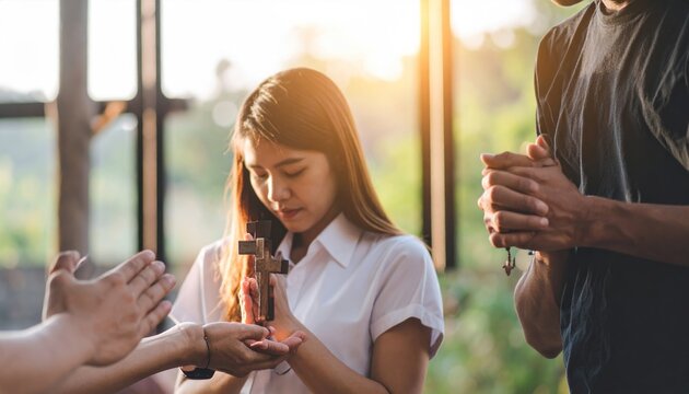 Diverse Group of Christians Praying Together Holding a Wooden Cross