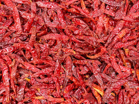 Pile of Dried Red Chili Peppers at Mexican Market &ndash; Spicy Food Ingredient Background Texture