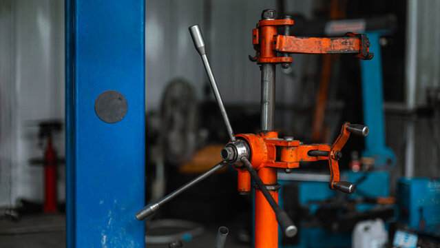 Strut Coil Spring Compressor Tool In Car Garage Service