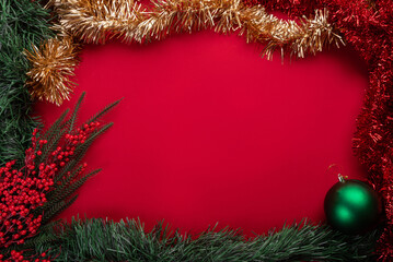 Christmas decorations on red background © Mateus
