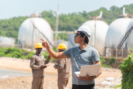 Architect at work in a construction site Engineers man construction safety work concept and construction industry  .Engineer Concept