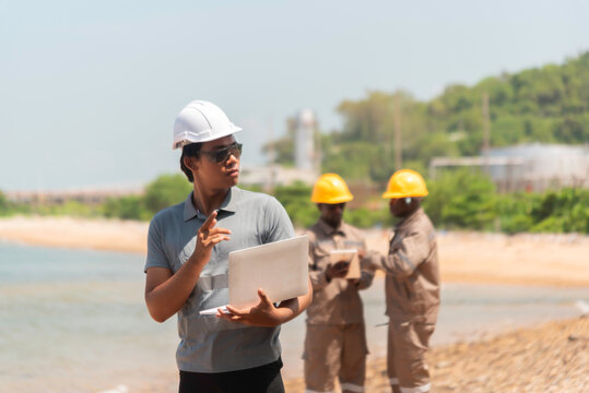 Architect at work in a construction site Engineers man construction safety work concept and construction industry  .Engineer Concept