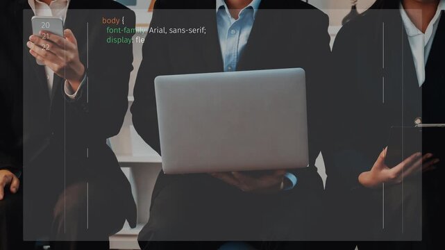 A diverse business team collaborates in a modern office, using technology and programming. They focus on digital solutions and innovative strategies for effective teamwork. Raster