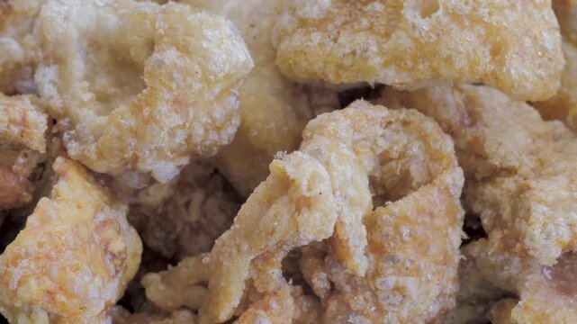 Crispy pork rinds.Golden brown deep-fried chicharron