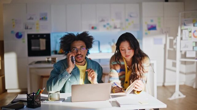 Multiethnic partners talking phone call startup office. Man negotiating client.