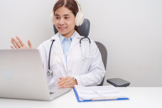 Professional doctor using laptop for telehealth, telemedical, online consultation and video meeting about November Lung Cancer Awareness month, World Cancer Day and health concept in hospital