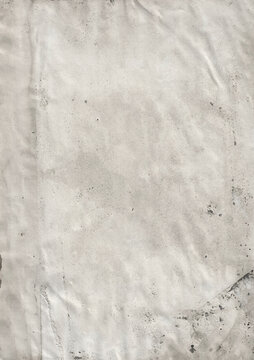 Aged and stained paper texture with subtle wrinkles and dark spots