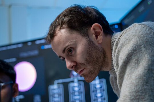 Software engineering use computer working develop AI office are assisting algorithm systems or verifying code. Programmer teamwork using artificial intelligence on laptop analysis or writing coding