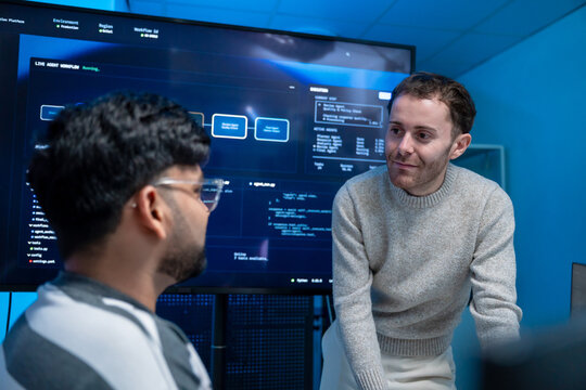 Software engineering use computer working develop AI office are assisting algorithm systems or verifying code. Programmer teamwork using artificial intelligence on laptop analysis or writing coding