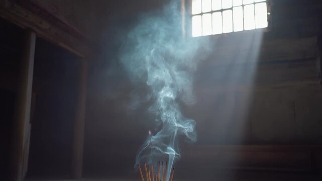Incense Smoke Rising in Sunbeams Through Window in Dusty Old Room