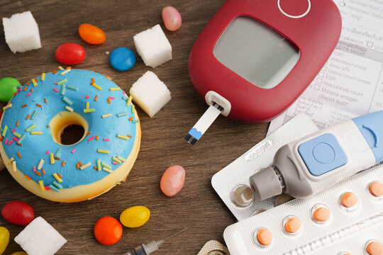 Diabetes and digital blood glucose measure with sugar.