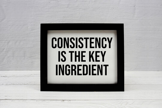Consistency Is The Key Ingredient text written on wooden frame