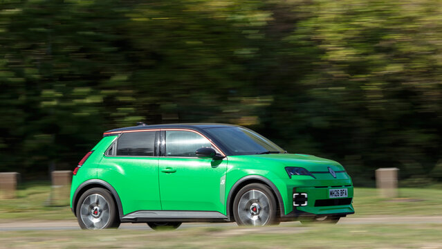 Milton Keynes; UK - Sept. 26th 2026:  2026 green Renault 5 techno + e tech electric  car driving on a British road