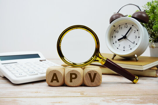 APV Adjusted Present Value alphabet letters with magnifying glass, calculator and alarm clock