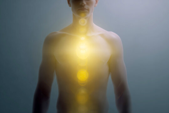 Front view human torso with glowing chakra energy centers aligned vertically for wellness background and holistic healing poster design