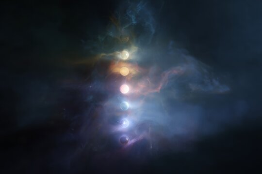 Vertical chakra energy system with glowing seven chakra spheres in cosmic mist for spiritual background and wellness design