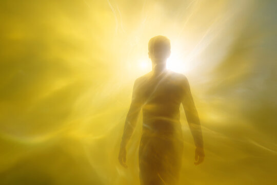 Solar plexus chakra energy silhouette with intense yellow light aura for meditation background and healing wellness poster