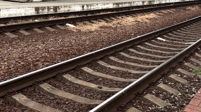 Railway tracks on an open platform. The prospect of traveling by rail.