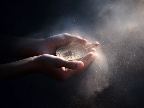 Hands cradling a glowing compass on a dark cosmic background for spiritual guidance poster or wallpaper design