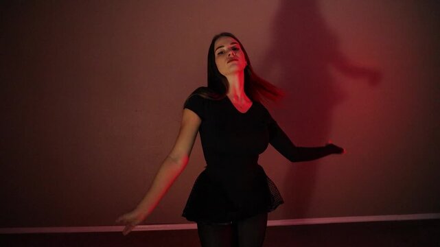 Beautiful young female dance performer dancing alone in slow motion