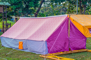 Scout tent on a green field for student school camping activity. © Musrifin