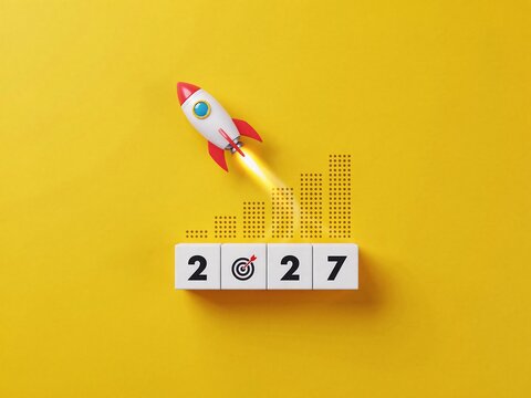 Rocket launching from blocks with 2027 date symbolizing future growth and success
