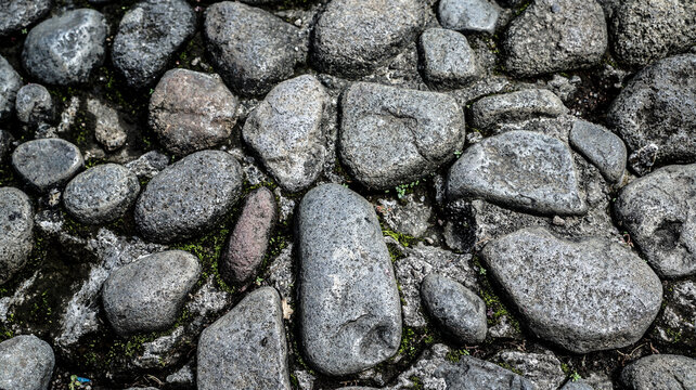 Stone rock wall as a background or texture