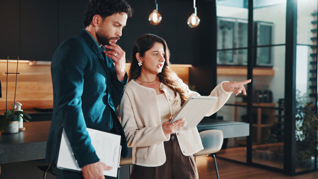 Realtor, people and team planning with tablet for listing, property value and market price idea. Real estate agent, discussion and thinking in home for sale strategy, pointing or inspection with tech