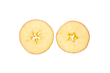 Two fresh apple halves shown from above on a transparent background, revealing pale yellow flesh, seeds, and natural core patterns. © Mukta