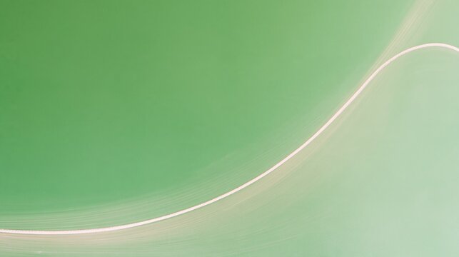Gaussian curve drawn on a pale green chalkboard with a powdery texture and soft light, providing a clean background for statistics and education