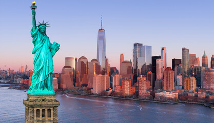 NYC landscape with Statue of Liberty. Manhattan cityscape over Liberty Statue. New York with famous towers and Liberty Statue. NYC skyscrapers with Statue of Liberty. © Volodymyr