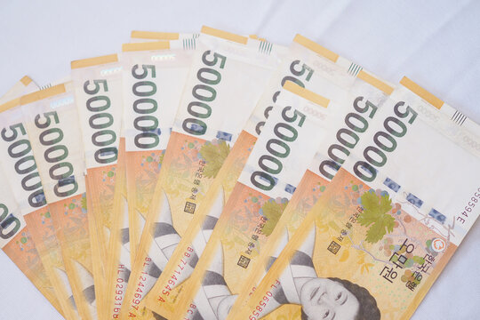 The currency of Korea which is used to represent value in exchange and the won is the main currency of Korean people. Korean won notes for money concept background.