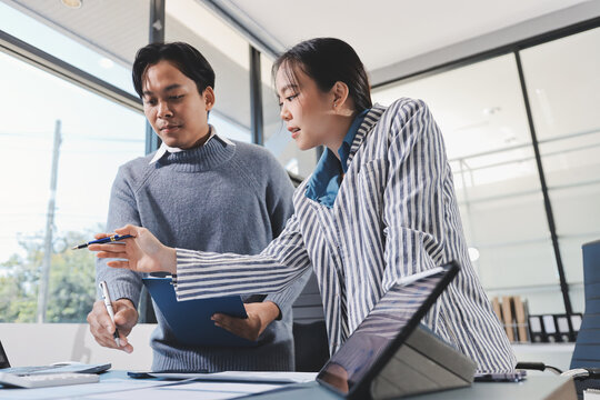Business professional analyzing financial data on digital tablet dashboard with calculator and laptop, representing accounting software, ERP system integration, performance monitoring.